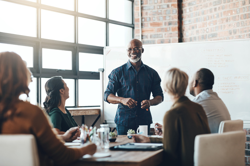 Shot of a businessman giving a presentation to his colleagues in a boardroom